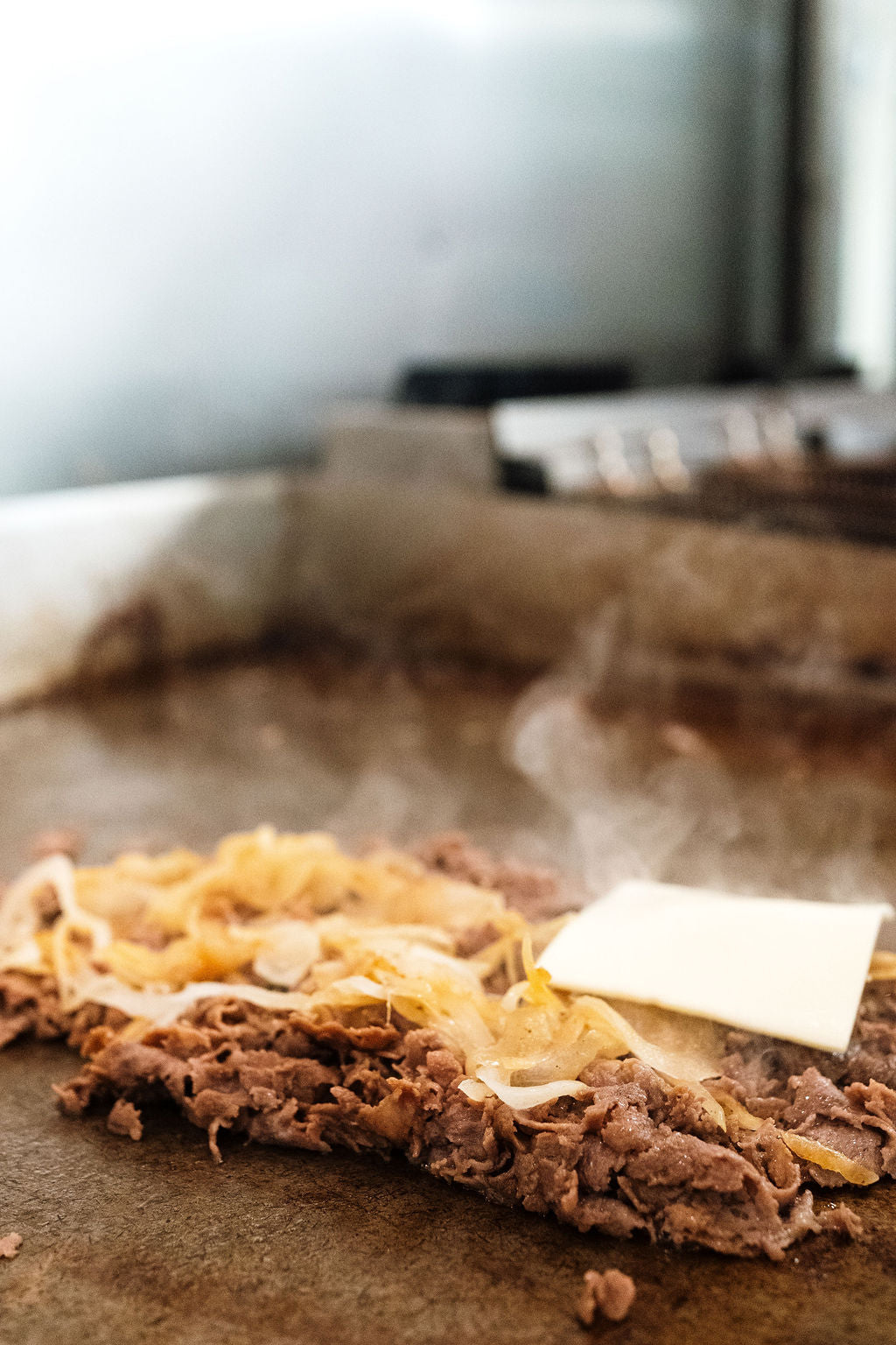 Cheesesteak on the grill top at Joes Pizza